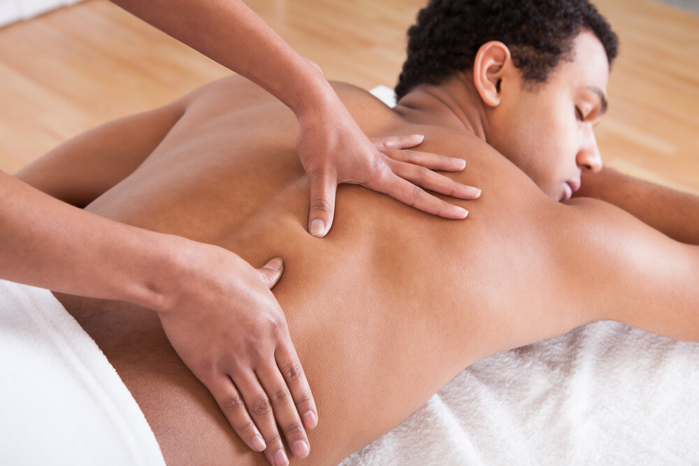 Professional Swedish Massage treatment with essential oils in serene spa environment